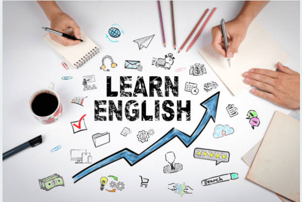 Trainer guiding students through English-speaking activities